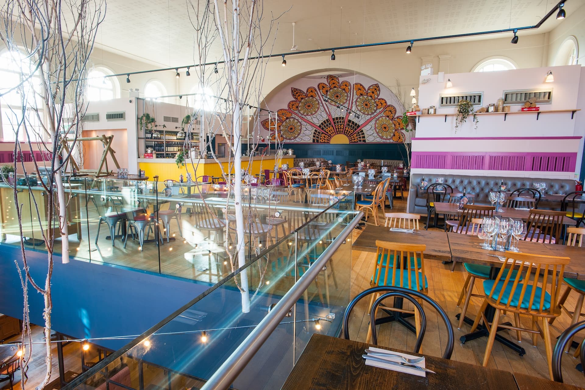 Zizzi York features vibrant and spacious interior with artistic murals and modern Italian dining style.