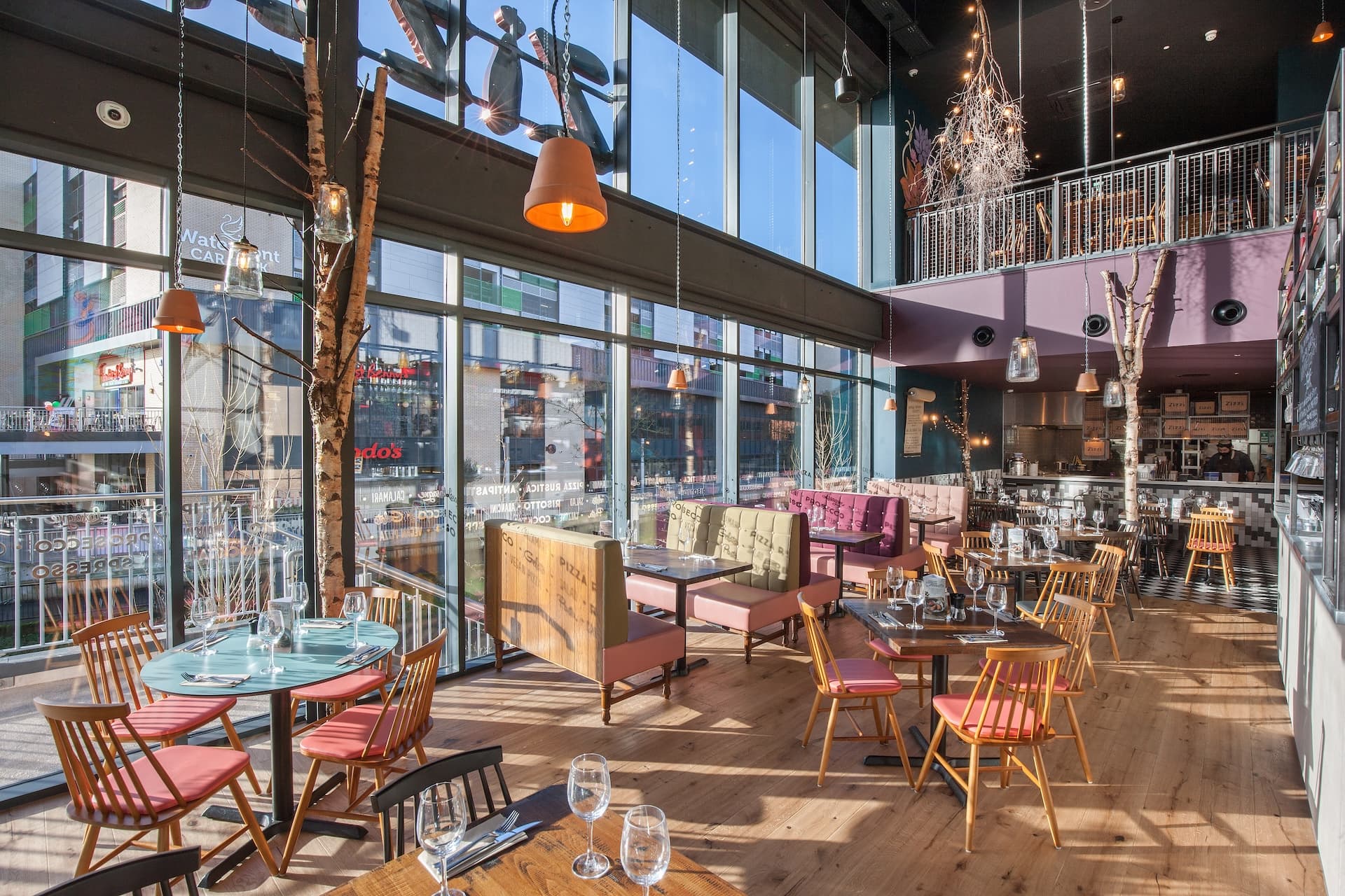 Stylish dining area at Zizzi Stafford with modern decor and natural accents.
