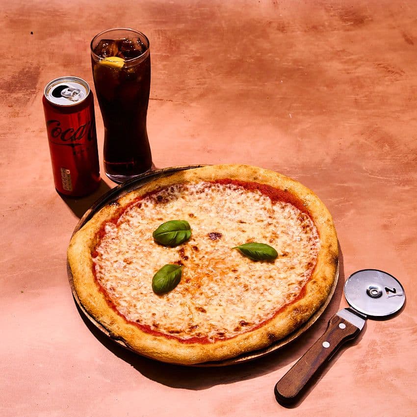 Classico margherita pizza with can of Coke