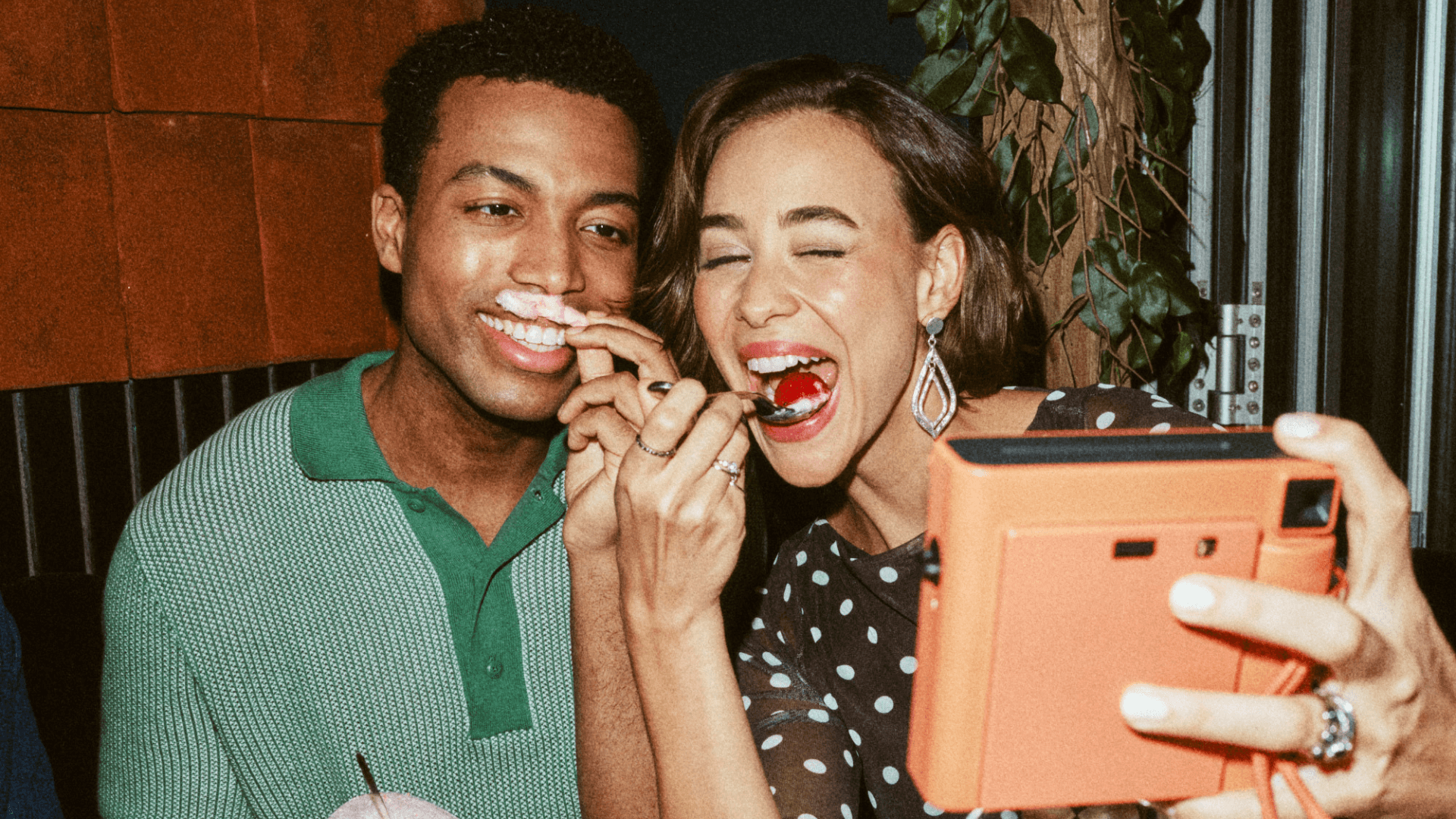 Friends taking selfies and smiling