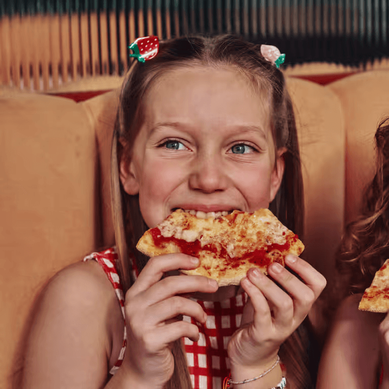 Girl eating pizza