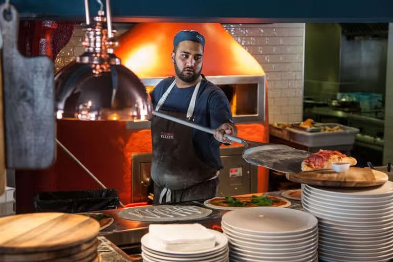 Pizza chef with calzone
