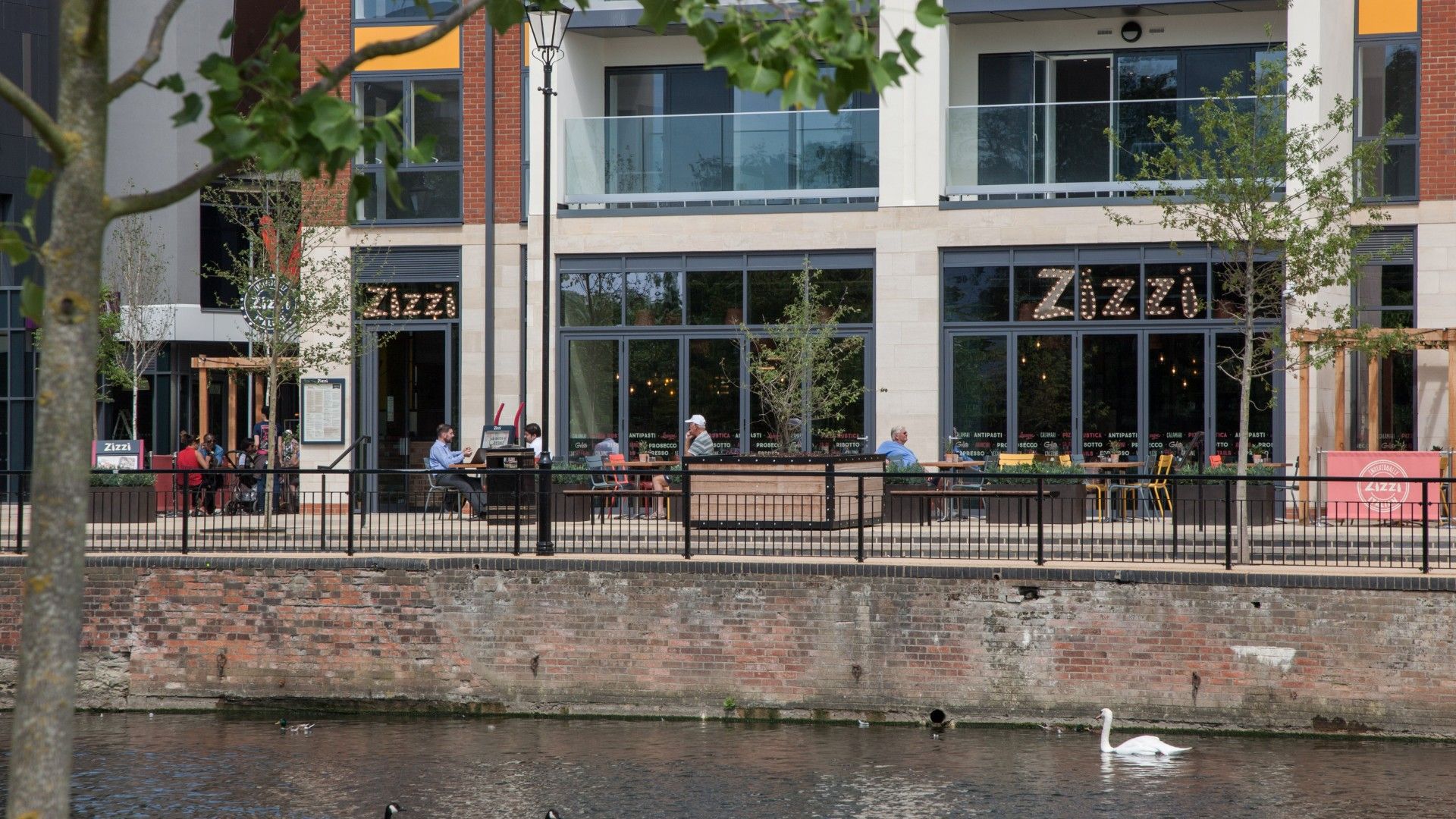 Exterior view across the river of Zizzi Bedford 