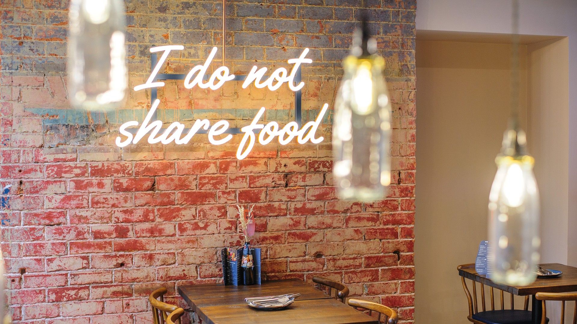 Neon sign saying I do not share food Zizzi Market Harborough 