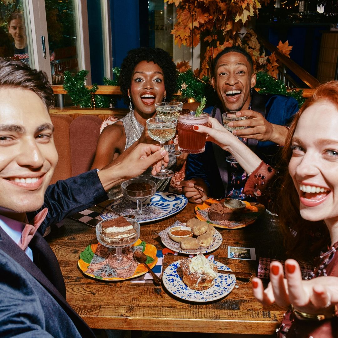 Group of people clinking glasses 