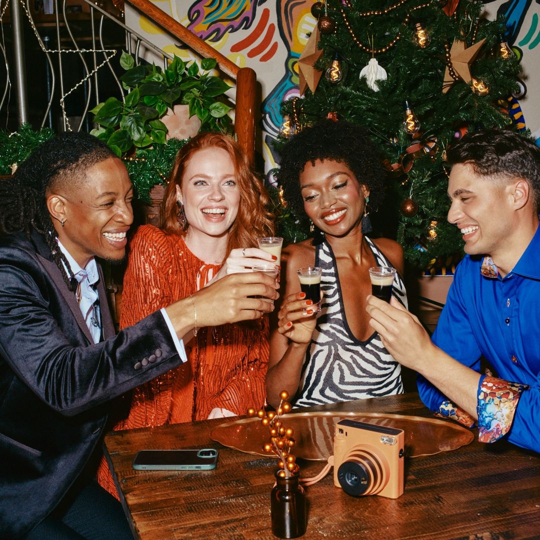 A group of friends enjoying drinks together for New Year's Eve 