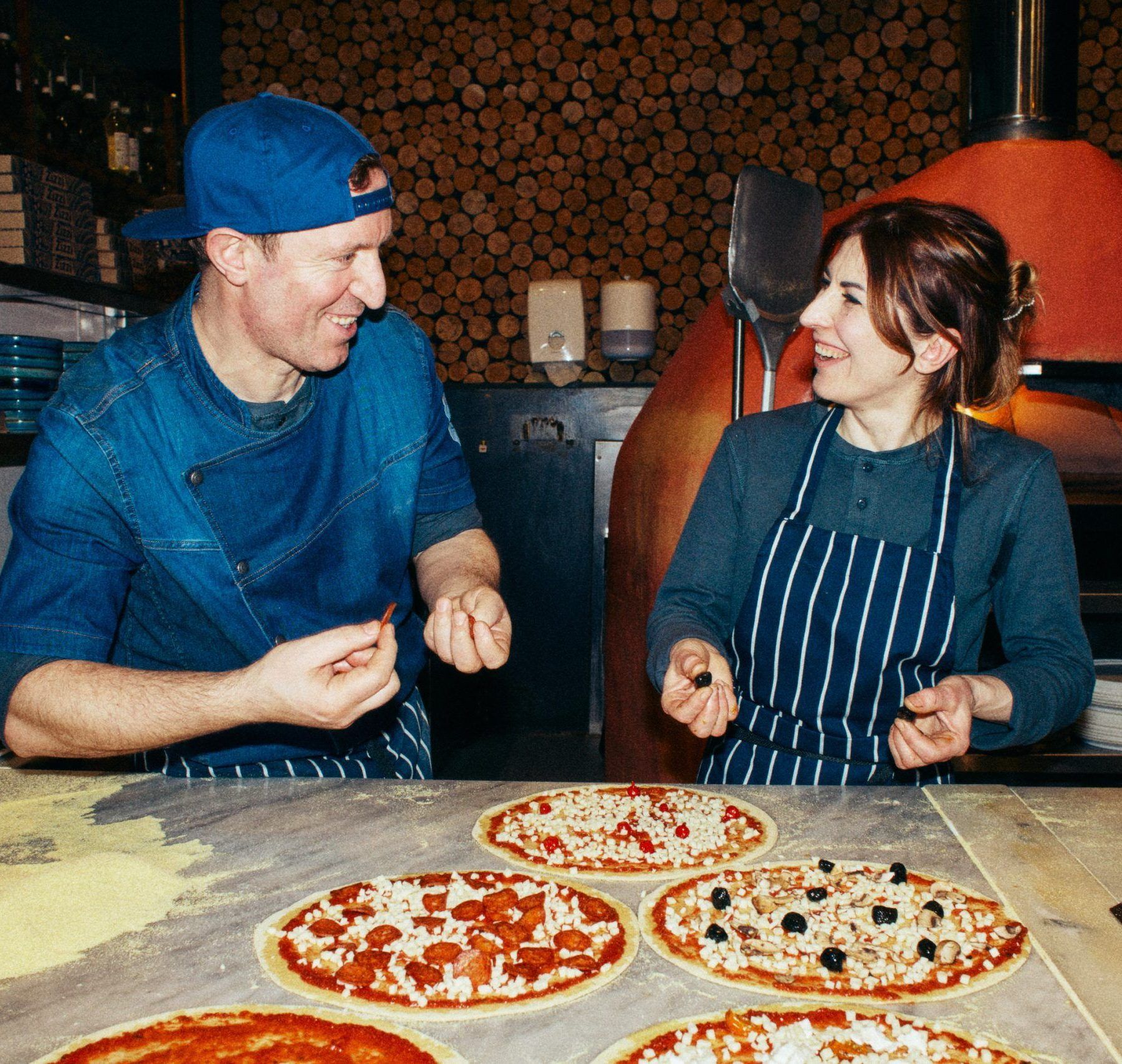 Zizzi chefs chatting to each other and smiling 